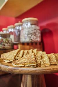 a tray of crackers and other snacks on a table at Appart'hôtel Odalys City Campus - Paris Rueil Malmaison in Rueil-Malmaison
