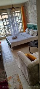 Ένα ή περισσότερα κρεβάτια σε δωμάτιο στο Sunny studio chic comfort near UN