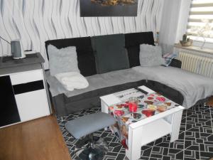 a small room with a bed and a table with a chair at Ferien und Monteurwohnung in Bad Berneck im Fichtelgebirge +6 photos