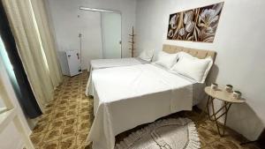 Postel nebo postele na pokoji v ubytování Quarto próximo ao Aeroporto Internacional