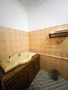 a bathroom with a sink and a counter at d'Alvin Double Room in Labuan Bajo +59 photos