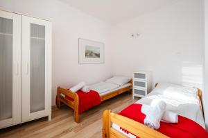 Posteľ alebo postele v izbe v ubytovaní Apartamenty Smrekowa Zakopane