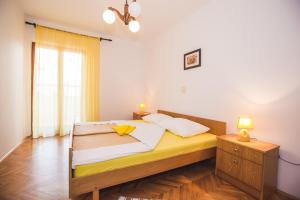 Postel nebo postele na pokoji v ubytování Apartments Renata + 37 fotografií