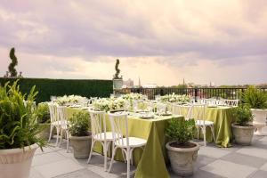a table set up for a wedding on a roof at Market Pavilion Hotel in Charleston