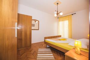 Postel nebo postele na pokoji v ubytování Apartments Renata