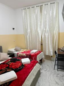 Postel nebo postele na pokoji v ubytování RATTAZZI ROMA CENTRo
