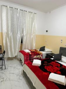 Postel nebo postele na pokoji v ubytování RATTAZZI ROMA CENTRo