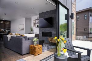 a living room with a couch and a fireplace at Million-Dollar Views, Luxury Stay Near Park City in Keetley