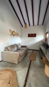 a living room with a bed and a table at Casa Vivienda - Barra Grande in Barra Grande +57 photos