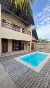 a swimming pool in front of a house at Casa Vivienda - Barra Grande in Barra Grande