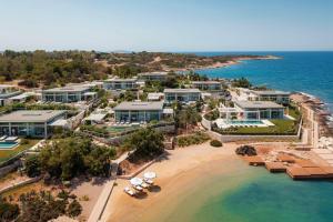 an aerial view of a resort on the beach at One&Only Aesthesis, Athens in Athens