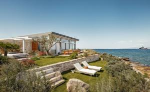 a house with a view of the ocean at One&Only Aesthesis, Athens in Athens