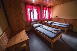 Postel nebo postele na pokoji v ubytování Chata Skalka