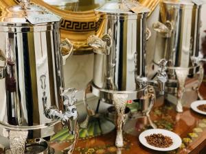 a group of silver appliances sitting on a table at Market Pavilion Hotel in Charleston