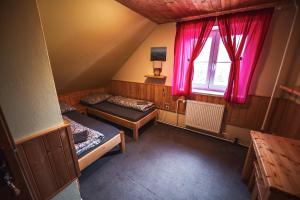 Postel nebo postele na pokoji v ubytování Chata Skalka