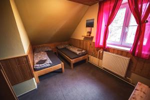 Postel nebo postele na pokoji v ubytování Chata Skalka