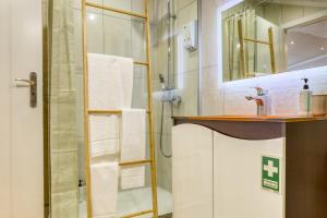 a bathroom with a shower and a sink and a mirror at Casa da Praia, a Home in Madeira in Ribeira Brava +38 photos