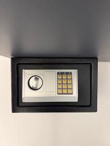 a remote control in a black box on a wall at Adele Hotel Ksamil in Ksamil