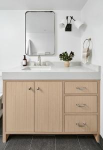 a bathroom with a sink and a mirror at Lux Ski-In Mt View Core 2 Bd2Ba in Aspen