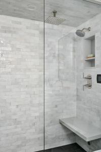 a bathroom with a glass shower with a sink at Lux Ski-In Mt View Core 2 Bd2Ba in Aspen