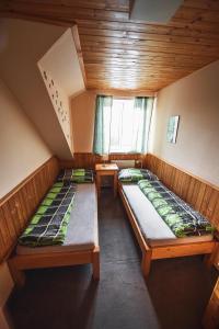 Postel nebo postele na pokoji v ubytování Chata Skalka