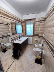 a bathroom with a tub and a sink and a toilet at Casa Terzi in Bologna