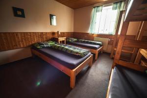 Postel nebo postele na pokoji v ubytování Chata Skalka