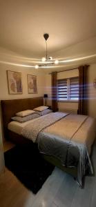 Posteľ alebo postele v izbe v ubytovaní Apartman Mirella