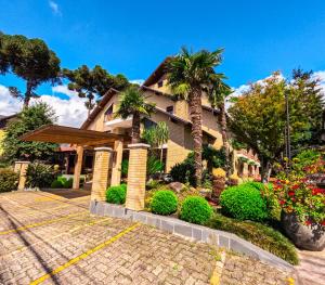 Um jardim em Hotel Pousada Kaster