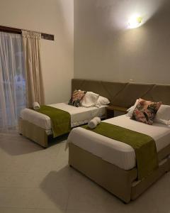Postel nebo postele na pokoji v ubytování Dorado hotel boutique
