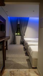 Кровать или кровати в номере Durrat AlJawharah Hotel Makkah