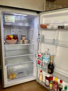 an open refrigerator filled with food and drinks at Great Ocean Road Sunrises in Lorne