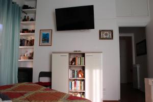 Un televizor și/sau centru de divertisment la A Casa di Vale