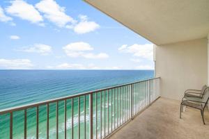 a balcony with a view of the ocean at 20th-floor condo with Gulf views, resort amenities & 2 lagoon-style pools in Panama City Beach