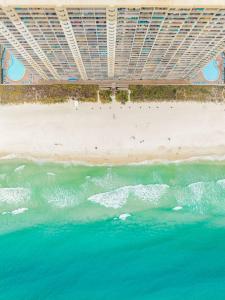an overhead view of a beach and the ocean at 20th-floor condo with Gulf views, resort amenities & 2 lagoon-style pools in Panama City Beach +31 photos