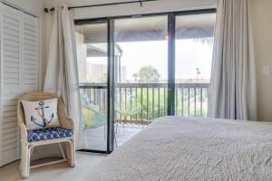 a bedroom with a bed and a balcony at Softsands Hideaway - Portside Resort - Sleeps 6 in Panama City Beach +31 photos