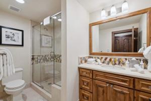 a bathroom with a toilet sink and a shower at The Charter at Beaver Creek C115 in Beaver Creek