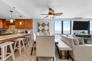 a kitchen and living room with a couch and a table at Gulf Peak Retreat - Watercrest 2 BR 2 BA - Sleeps in Panama City Beach
