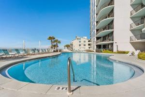 a swimming pool in front of a building at Gulf Peak Retreat - Watercrest 2 BR 2 BA - Sleeps in Panama City Beach
