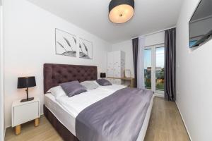 Postel nebo postele na pokoji v ubytování Villa Leah + 12 fotografií