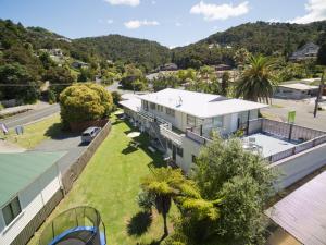 an aerial view of a house with a yard at Aarangi Tui Motel in Paihia