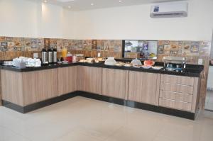 a kitchen with a counter with food on it at Lazzarus Hotel - Standard Plus 02 Camas-Casal&Solt ou Solt&Solt in Alexânia
