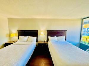 Postel nebo postele na pokoji v ubytování Vip inn and suites