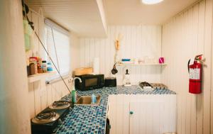 a kitchen with a counter with a sink and a microwave at Ocean Front Villa 4 Studio in Culebra
