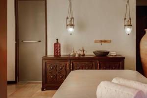 Voodi või voodid majutusasutuse Sharq Village & Spa, a Ritz-Carlton Hotel toas