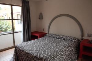 Postel nebo postele na pokoji v ubytování Hotel Real Ocotepec