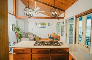 a kitchen with a stove top oven in a room at AMAZING Bay View Marea 2-2 in Culebra