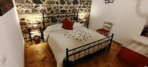 a bedroom with a large bed in a room at L’ANGOLETTO in San Lorenzo Nuovo