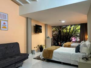 TV a/nebo společenská místnost v ubytování Provenza Medellin Hotel Boutique