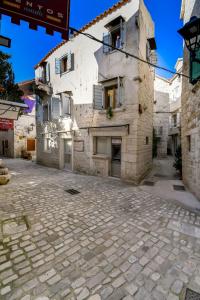 an empty street in front of a building at House Morski brk in Trogir